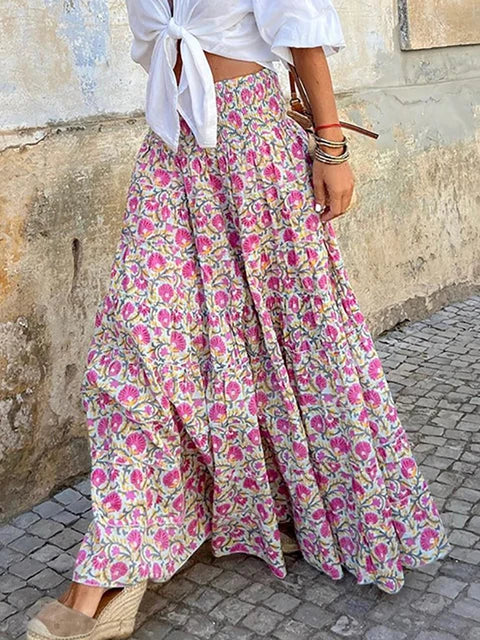 Shioban is een elegante boho maxi-rok met een flowy design, hoge taille en elastische tailleband met trekkoord voor de perfecte pasvorm. Gemaakt van een zachte polyester-spandexmix voor ultiem comfort. Met handige zijzakken voor extra functionaliteit. Ideaal voor casual dagen, kantoor of avondjes uit. Verkrijgbaar in Pink en Pink-Red, maten XS-XL. Voeg tijdloze stijl toe aan je garderobe met Shioban. Bestel nu en straal elegantie en comfort uit!
